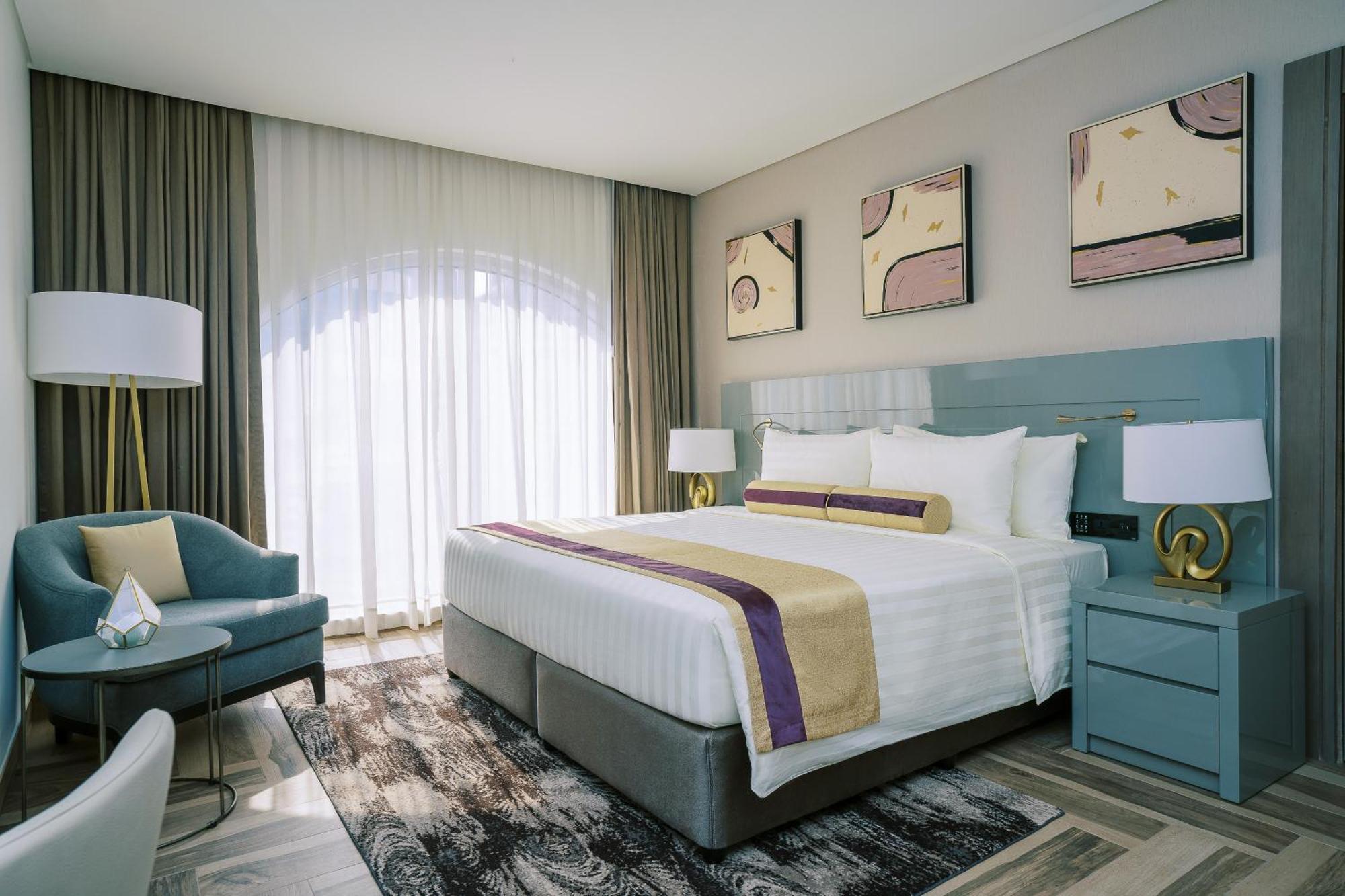 Khalidia Palace Hotel Dubai By Mourouj Gloria ภายนอก รูปภาพ A bedroom at the hotel