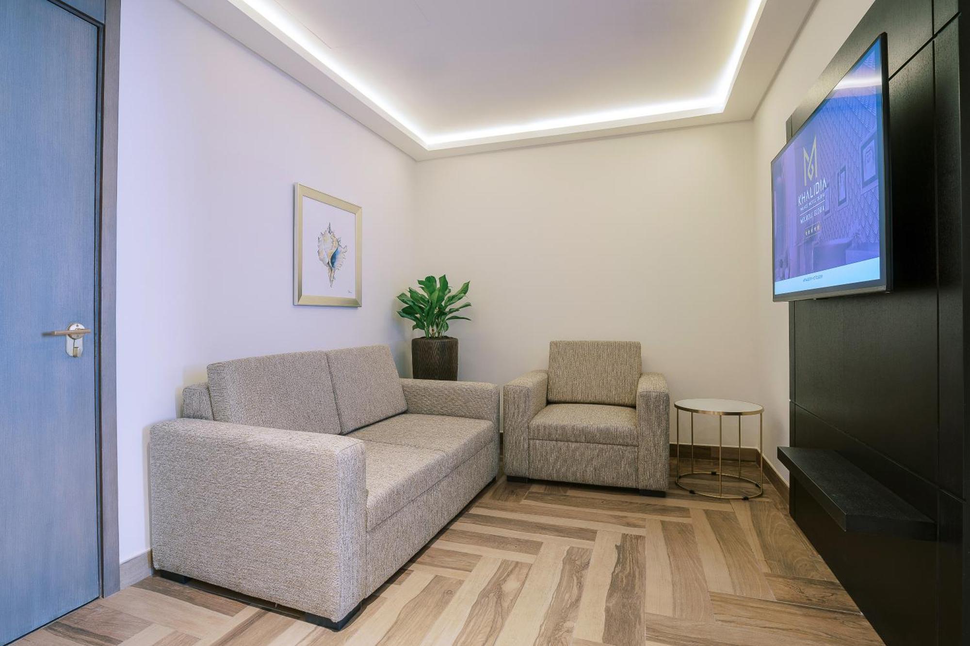 Khalidia Palace Hotel Dubai By Mourouj Gloria ภายนอก รูปภาพ A 3D rendering of a living room